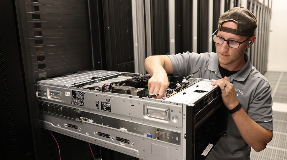 One of our data center techs pulling a GPU tray.
